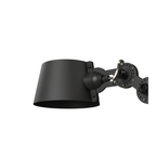 Close-up van de kap van de Tonone Bolt Wall Sidefit Mini wandlamp in de kleur smokey black.