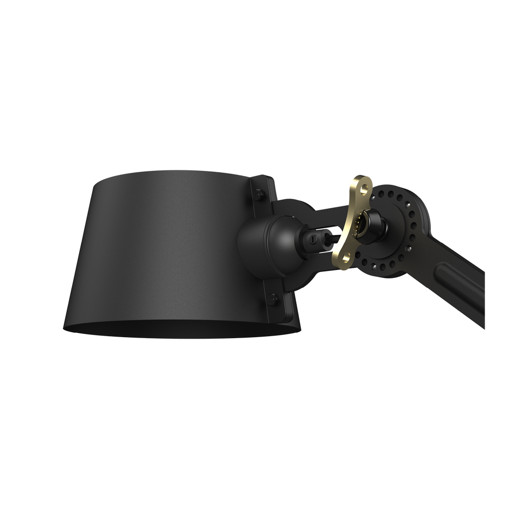 Close-up van de kap van de Tonone Bolt Wall Sidefit wandlamp in de kleur smokey black.
